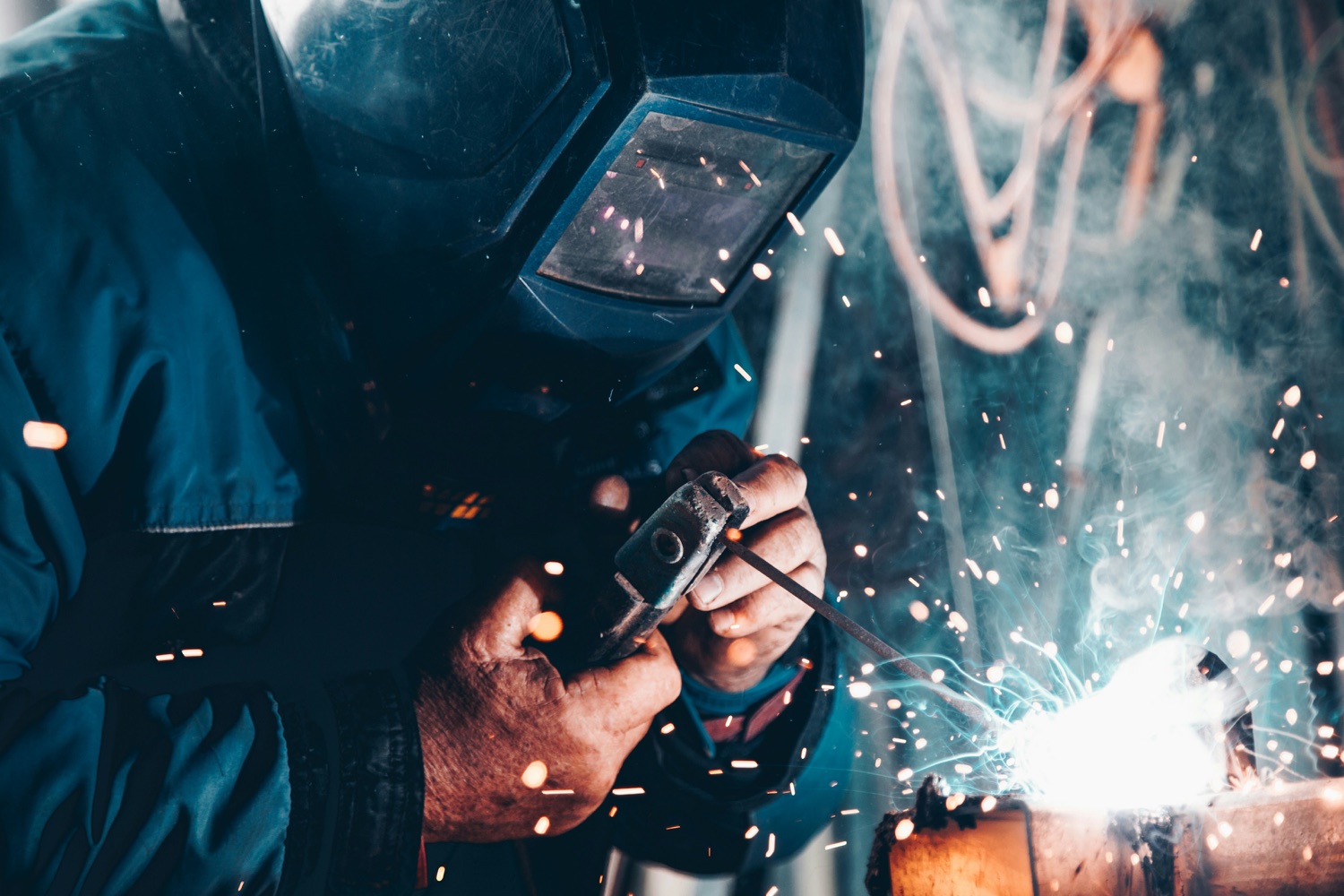 An HVACR technician brazing a copper refrigerant line