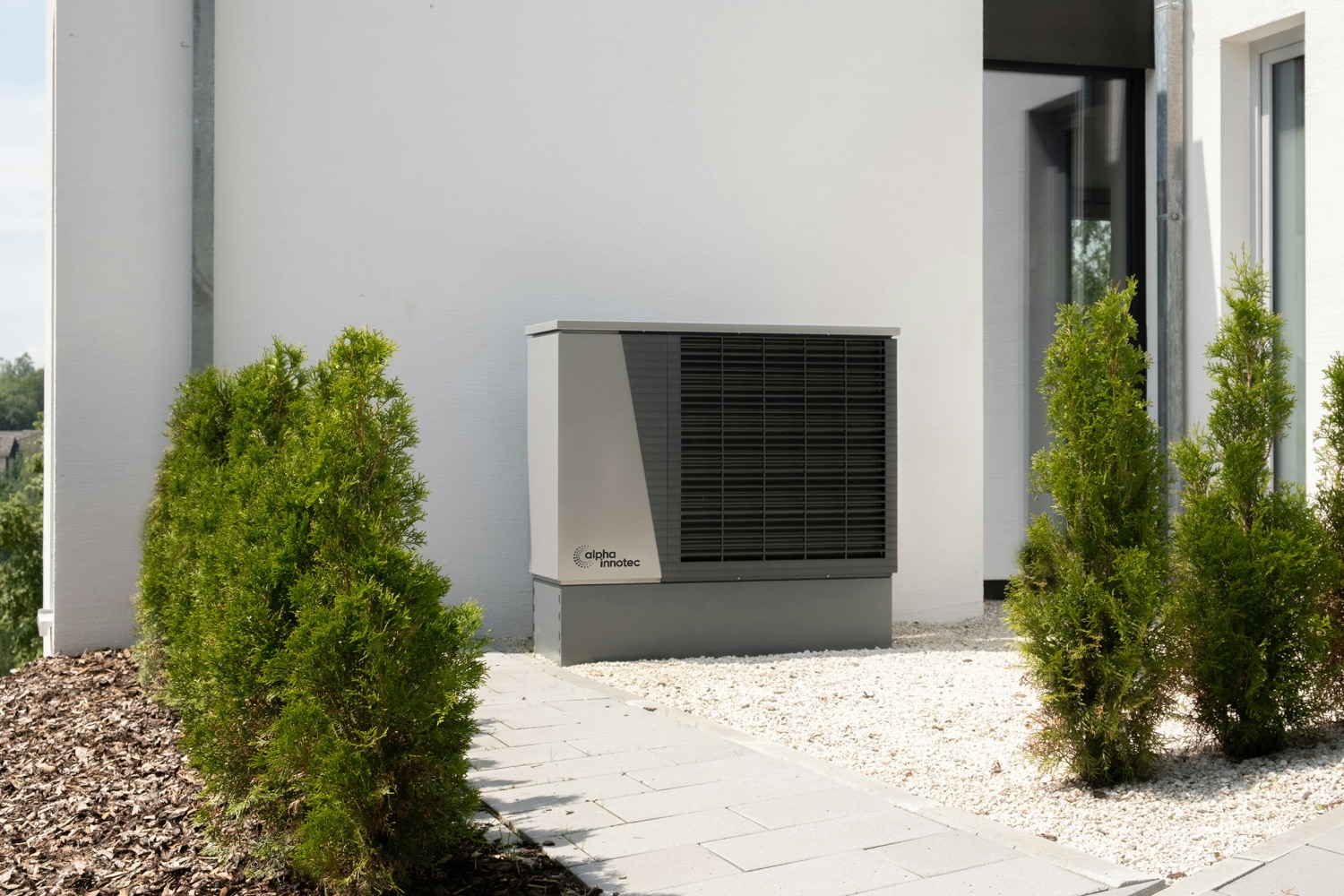 A modern high-efficiency heat pump installed beside a home